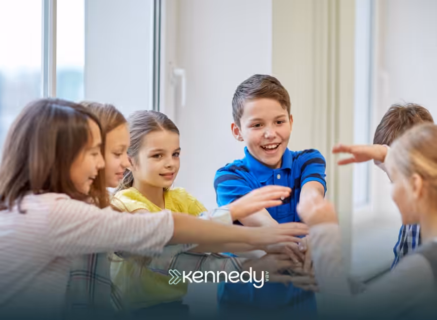 A boy with autism wearing blue shirt socializing with other kids