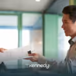 A UMR insurance agent handing insurance papers