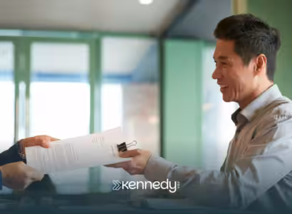 A UMR insurance agent handing insurance papers