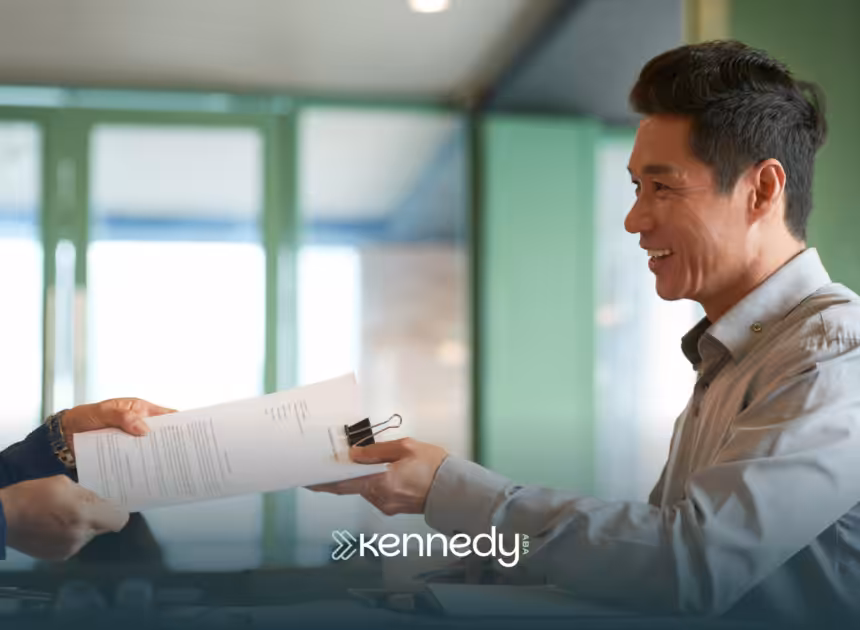 A UMR insurance agent handing insurance papers
