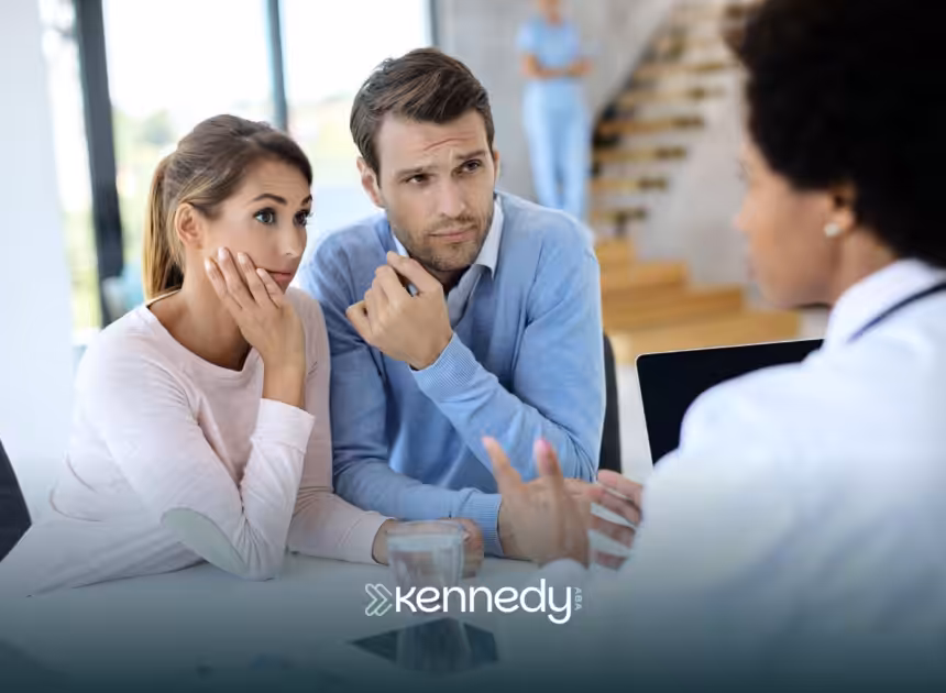 Parents of an autistic child talking to a UMR insurance agent