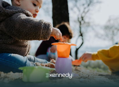 A kid with autism on a weekend activity, playing sand outdoors