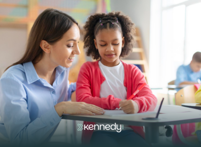 A kid with autism and an ABA therapist during school-based ABA therapy