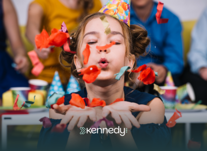 A kid with autism blowing confetti in an autism-friendly event in Hampton, VA