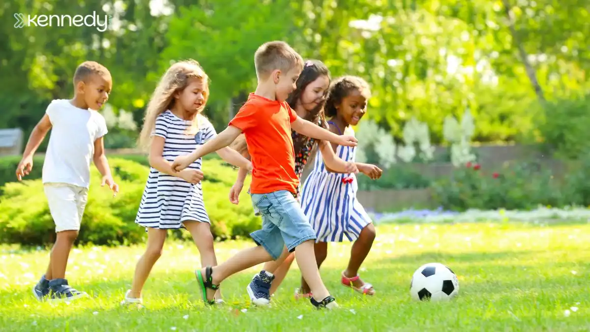 children-playing-soccer-together-in-park