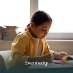 A kid with autism doing an activity at school