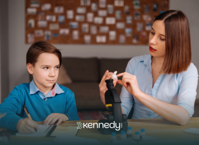 A kid with autism and an RBT during ABA therapy