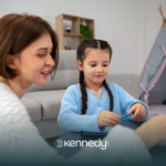 A kid with autism and her ABA therapist during ABA therapy at home