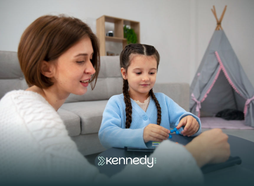 A kid with autism and her ABA therapist during ABA therapy at home