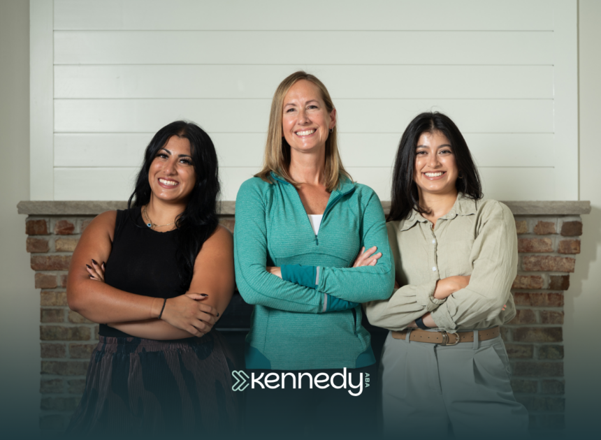 Three ABA therapists posing for a photo