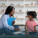 A BCBA talking to a kid during in-home ABA therapy in North Carolina