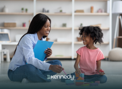 A BCBA talking to a kid during in-home ABA therapy in North Carolina