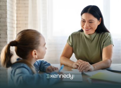 A kid with autism and a BCBA talking during ABA therapy