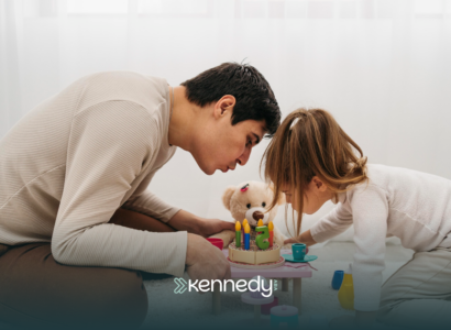 A father and her daughter with autism playing together