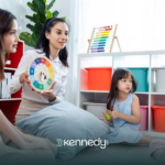 Therapists talking to kids during ABA therapy