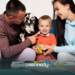 A family in Charlotte, NC, with a kid with autism and their family dog, sitting on a couch