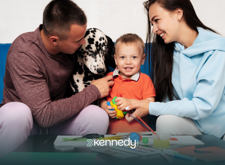 A family in Charlotte, NC, with a kid with autism and their family dog, sitting on a couch