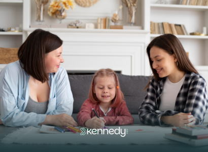 A mother, along with her kid with autism, talking to an insurance agent regarding prior authorization for ABA therapy