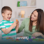 An ABA therapist and a kid with autism during home-based ABA therapy
