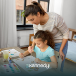 A therapist teaching a kid how to draw during ABA therapy