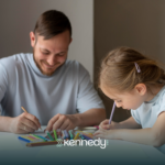 A kid with autism and her father boding together doing arts on a table