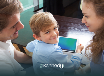 A kid with his parents using a mobile tablet