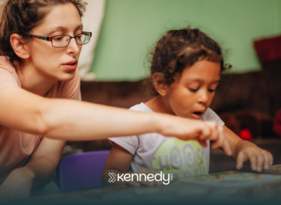 A kid with autism and her mother doing an activity at home