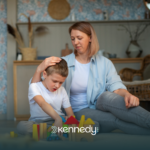A mother calming her autistic child after a meltdown