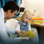 A BCBA helping a kid with autism to wait