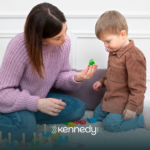 A BCBA and a kid with autism during ABA therapy