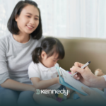 A mother with her daughter talking to a BCBA about an ABA treatment plan