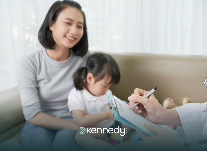 A mother with her daughter talking to a BCBA about an ABA treatment plan