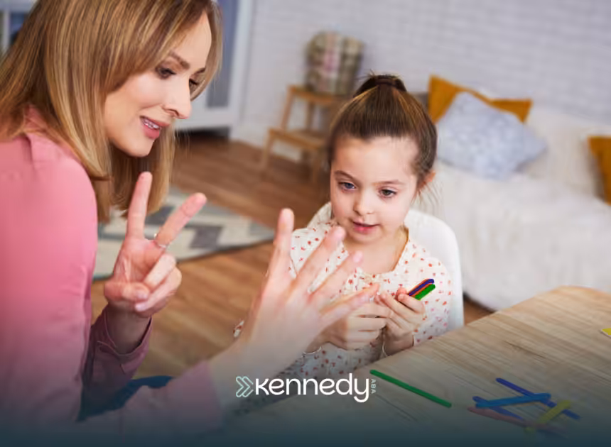 A BCBA helping a child communicate during ABA therapy