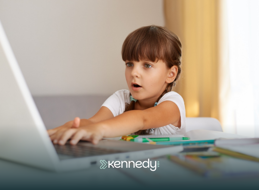 A kid with autism playing Minecraft on a laptop computer
