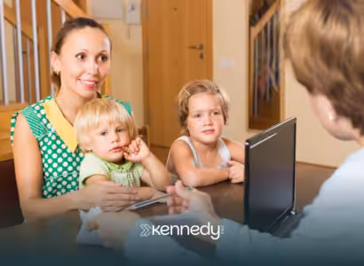 A mother, with her kids asking, asking questions to an insurance representative