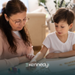 A BCBA teaching a child how to ask for help during ABA therapy