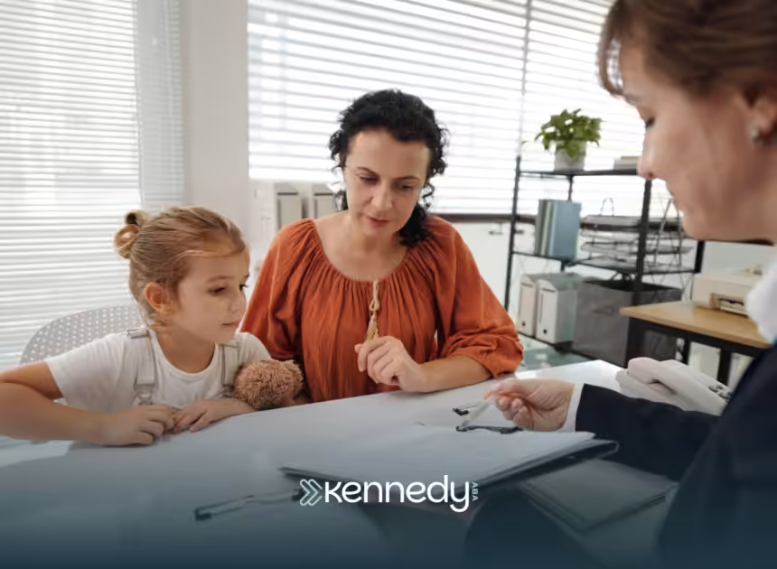 A parent with her child listening to an ABA therapist during ABA therapy