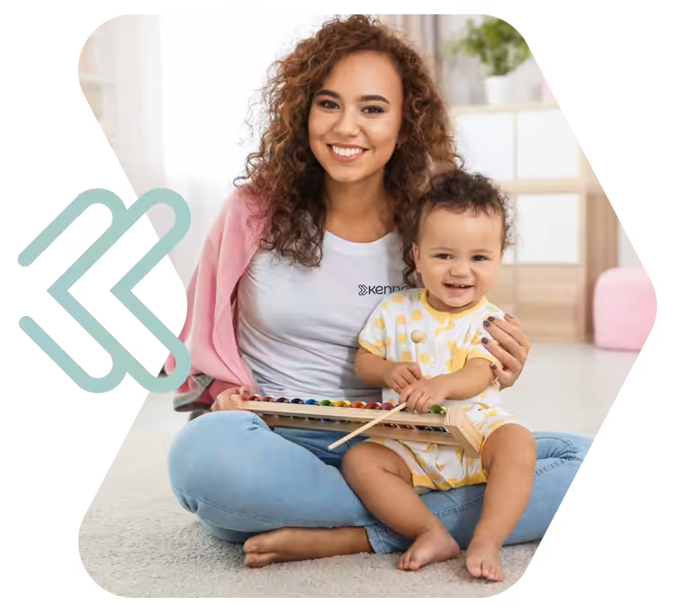 Kennedy ABA logo with smiling toddler