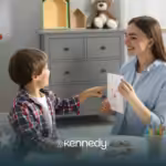 A child and a BCBA during ABA therapy at home
