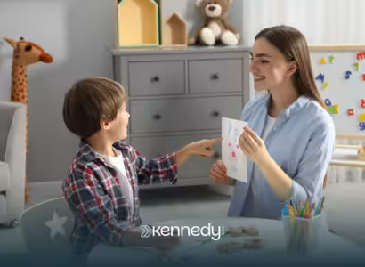 A child and a BCBA during ABA therapy at home