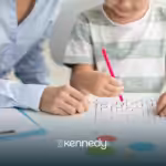 A child and a BCBA doing a puzzle