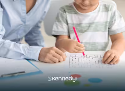 A child and a BCBA doing a puzzle