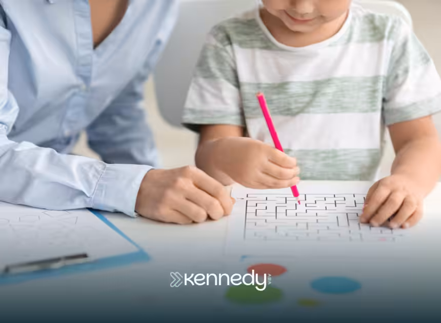 A child and a BCBA doing a puzzle