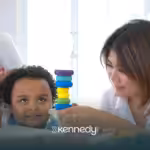 A kid and a BCBA during ABA therapy